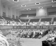 People gathered in an assembly hall at Grange convention thumbnail