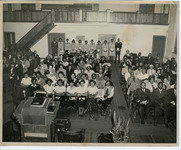 Attendees seated inside an unidentified church. thumbnail