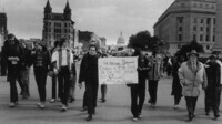 Marchers with Stonewall raid sign thumbnail