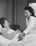 [Nurse Matilde Honda attending a patient at Colorado Central Hospital, Denver, Colorado] thumbnail