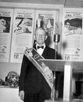 Unidentified man posing beside podium thumbnail