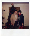 Michele Serros and her father in front of a Christmas tree thumbnail