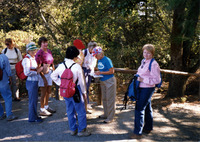 Women milling around on a hiking trail thumbnail