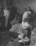 [Shoemakers at work in shoe repair shop at Heart Mountain incarceration camp] thumbnail