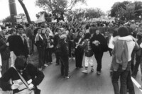 Marchers standing and milling around thumbnail