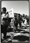 [Protesters marching, child holding sign] thumbnail