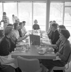 Alpha Omicron Pi women enjoy a meal together. thumbnail