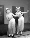 Two girls hula dancing thumbnail