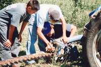 Montoya farm, Repairing farm equipment 003 thumbnail