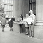 Group holding protest signs against Vietnam War thumbnail