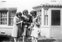 Home Economics students with a child. thumbnail