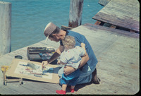 Rollin painting with Joel on a pier thumbnail