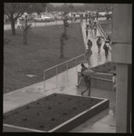 [Students walking in rain] thumbnail