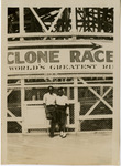 African American couple posed in front of the Cyclone Racer, Long Beach, CA, July 1949. thumbnail