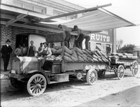 Transporting sacks by open truck. thumbnail
