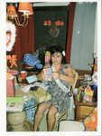 Michele Serros with gifts thumbnail