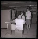 Women at mainframe computer terminal thumbnail