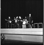 A band performs onstage. thumbnail