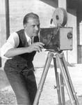 Man in filming pose. thumbnail