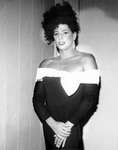 Female impersonator wearing an off the shoulder dress. thumbnail