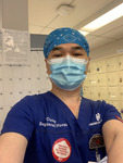 Photograph of Nurse Cuong Phu Pham in Mask and Blue Head Wrap thumbnail
