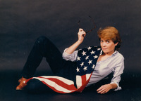 Claire Mix posing with the American Flag thumbnail