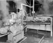 Putting lids on glass jars of fruit. thumbnail