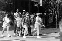 Faculty and staff walking. thumbnail