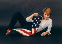 Claire Mix posing with the American Flag thumbnail
