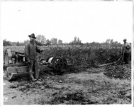 Two men and farm machinery thumbnail