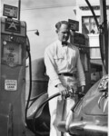 Red Williams pumping gas at station in Pacific Grove. thumbnail