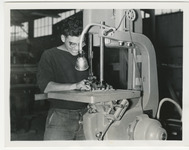 [Engineering student working with industrial manufacturing equipment] thumbnail