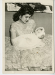 Michele Serros and her mother on her baptism day thumbnail