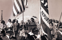 [Speaker flanked by Cal Poly President Kennedy and Poly Princesses] thumbnail