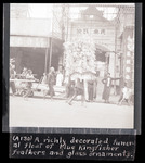 (A130) A richly decorated funeral float of blue Kingfisher feathers and glass ornaments. thumbnail