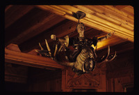 Wyntoon, Cinderella House, interior, antler chandelier, wood carving thumbnail