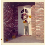 Michele Serros outside of a house door thumbnail