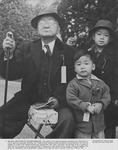 [A grandfather and his grandchildren waiting to be incarcerated, Hayward, California, May 8, 1942] thumbnail