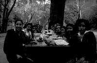 Group of teenage girls eating lunch at a picnic table thumbnail