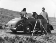 Rollin painting as Glenna reads thumbnail