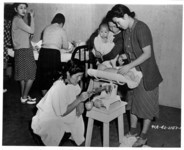 Weighing baby. thumbnail