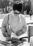 Female student browsing books. thumbnail