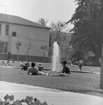 Students relax on lawn thumbnail
