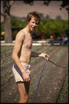 [Student holding irrigation line off the ground] thumbnail