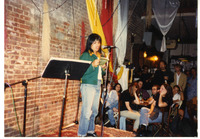 Michele Serros reading on stage thumbnail