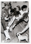 Photograph of girls petting dogs and a descriptive note thumbnail