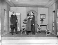 Two men and a woman performing. thumbnail