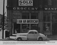 Grocery store with a sign ""I am an American"" placed on its front on December 8, 1941 thumbnail