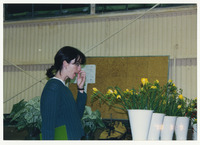 [Woman observing plants] thumbnail