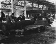 Electric truck being loaded with logs for Oregon display thumbnail